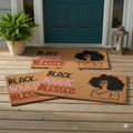 One doormat with 'Black. Bougie. Blessed.' text and a silhouette of a woman .